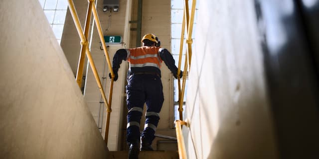 Contractor walking up stairs