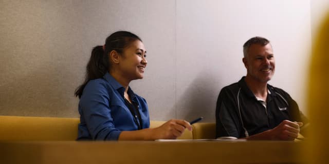 2 people in a meeting