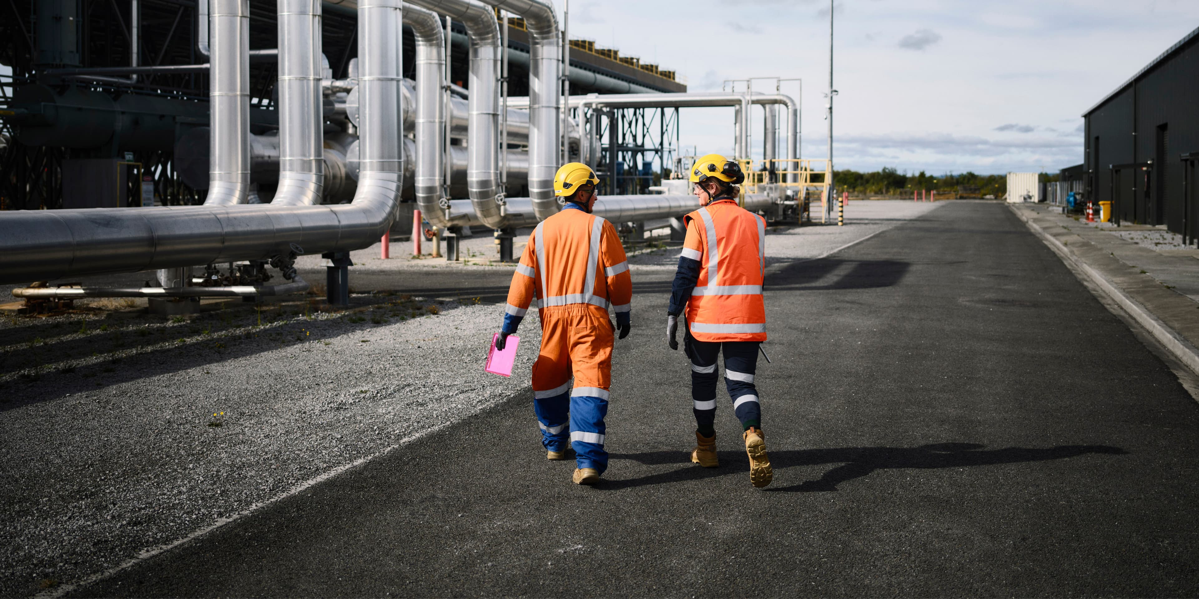 2 people in high viz on site