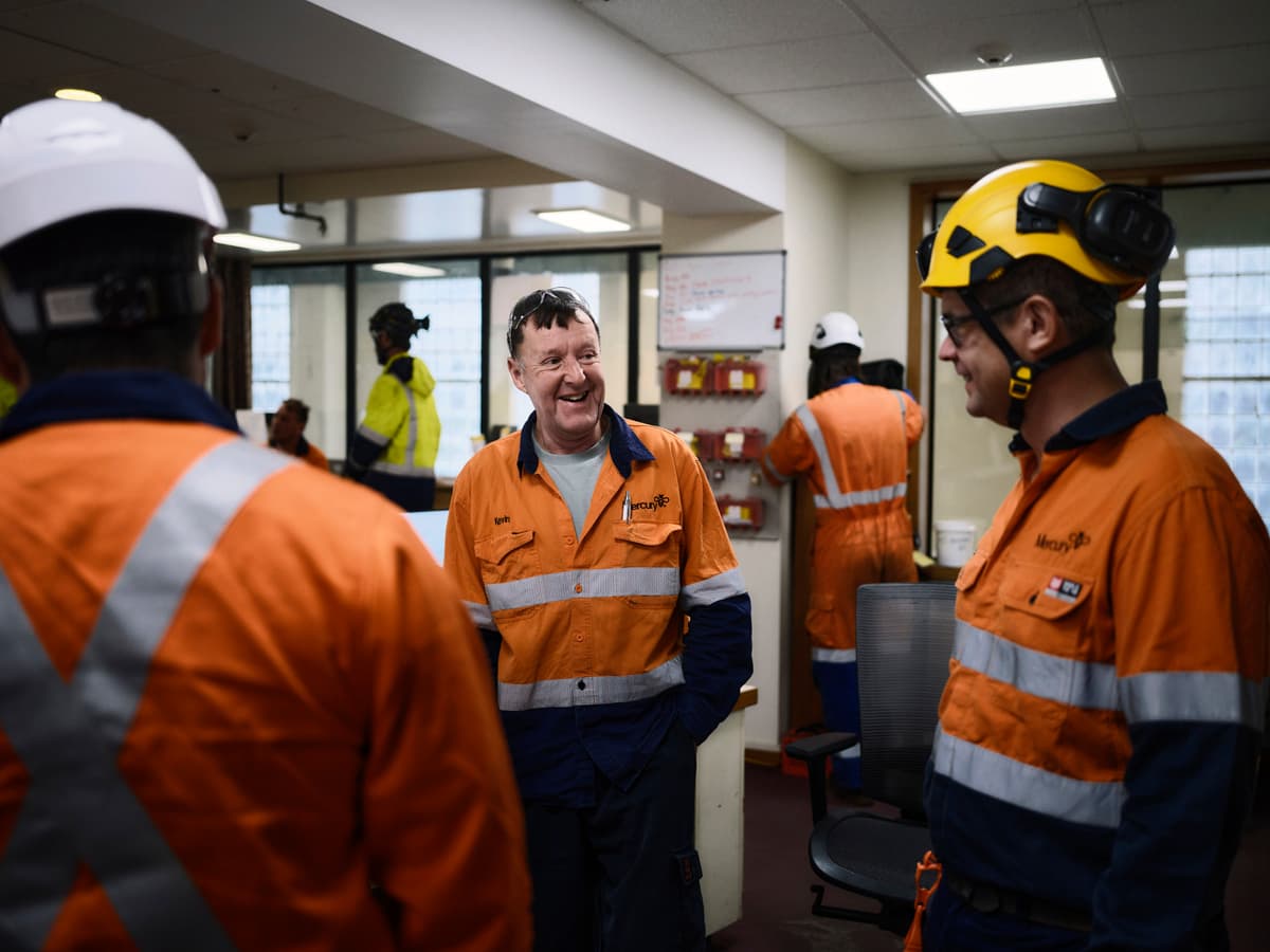 Group of workers talking cheerfully