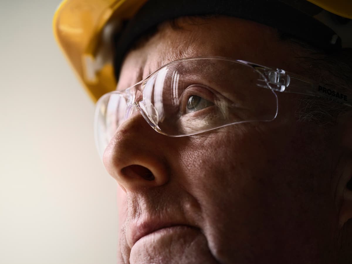 Close up of workers face in safety gear
